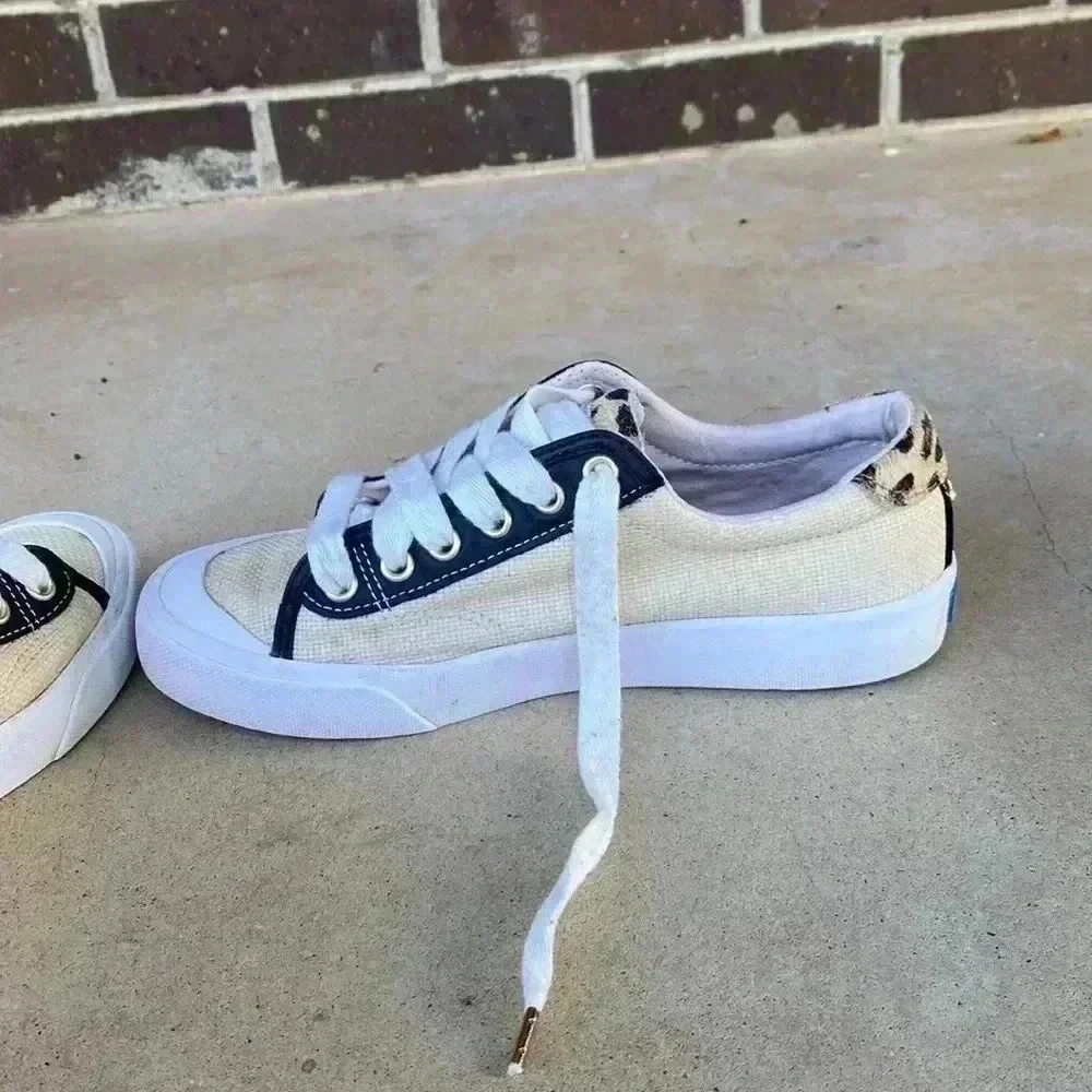 Keds beige canvas sneakers with black trim and leopard heel